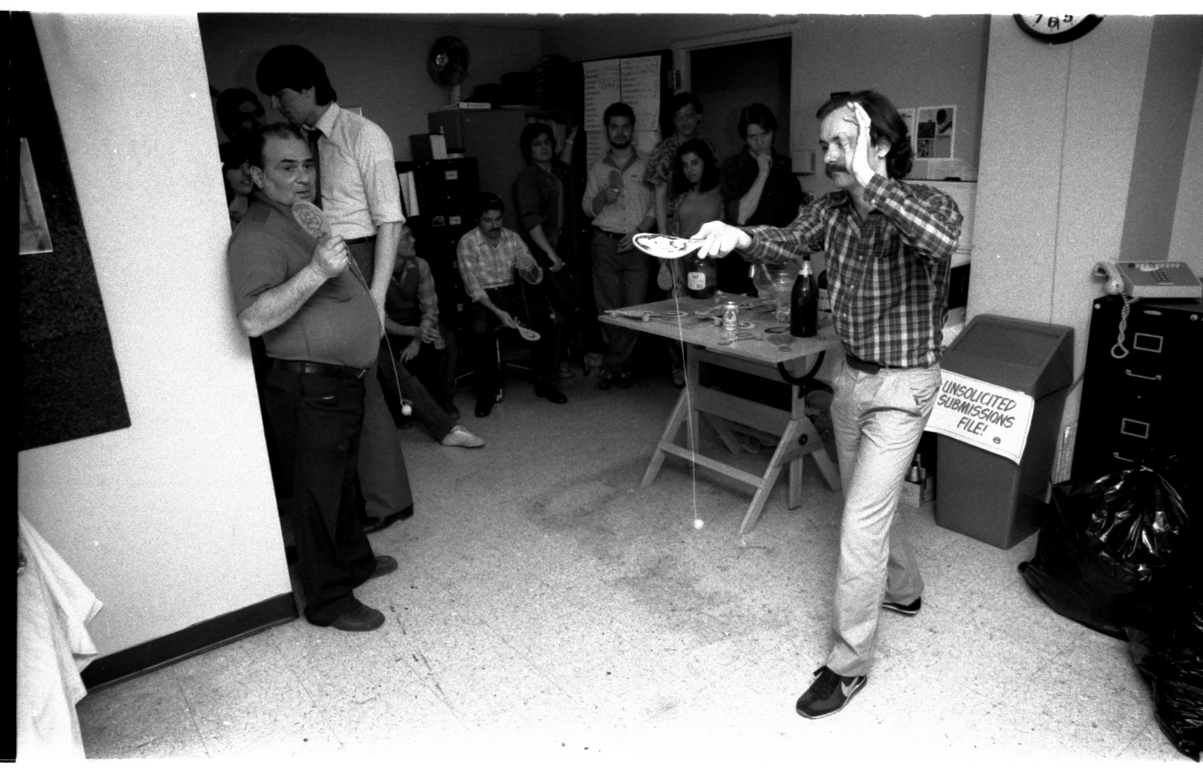 Mark Gruenwald, who really did practice, shows us how it's done! Danny can't believe his eyes. A dejected Shooter just leaves the room (to go to his office-- this whole area is his ante-room).