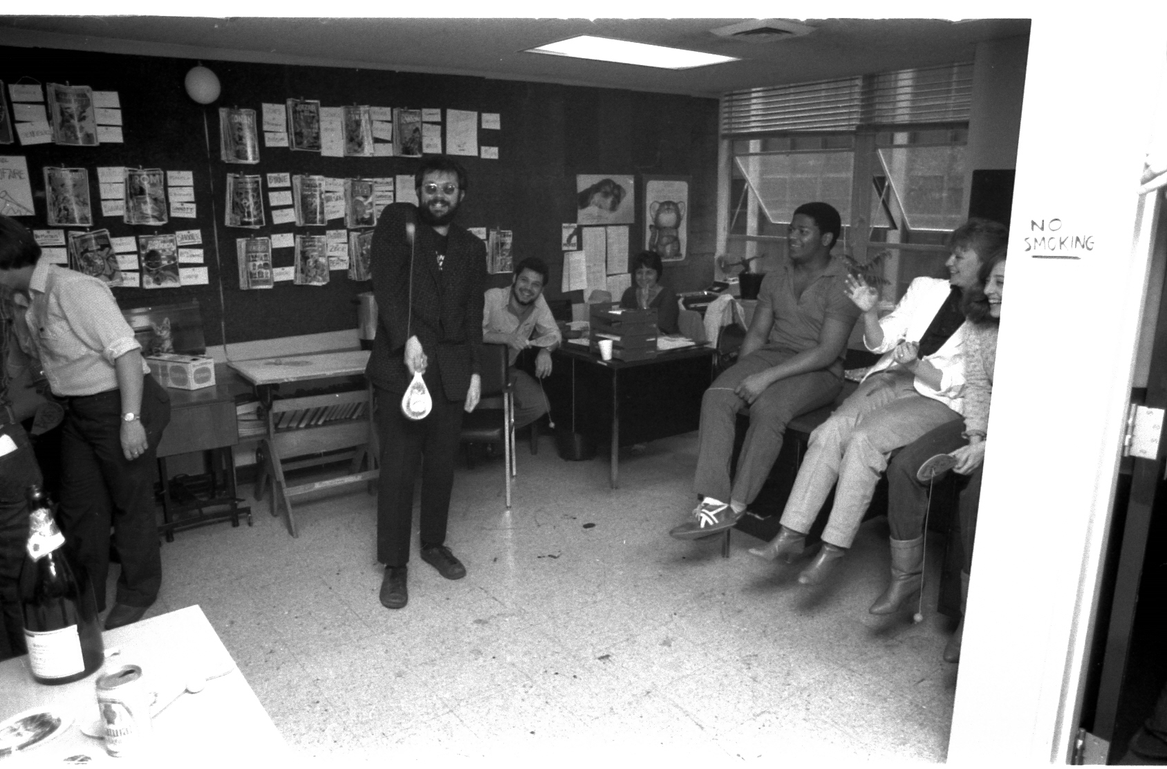 Rick Parker tries his damndest to take out the photographer! To the rear: on the left are unknown Interns, behind Rick is Harry Candelario, Virginia Romita, seated are Lance Tooks, Frankie Sienkiewicz and Linda Florio.