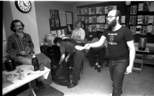 Editor, inker, artist Al Milgrom-- it would take a far better photographer than me to reveal that the ball and string is actually wrapped around Al's inkin' hand! Al is sporting last year's fashion in custom-made Bullpen T's-- first worn by the Marvel baseball team. Mark looks on aghast.