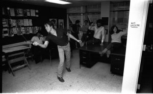 Now Bob is just showing off! Tom DeFalco, who knows better than to commit these actions to any recording medium such as photography, is just behind Bob. John, Jr., is looking out the window, bored to tears-- his mother wiped up the floor with all of the contestants, fer cryin' out loud. Jack Morelli is to his right-- he's seen it all. Jim Salicrup and Linda Florio are running for their lives as that ball ricochets all about them.