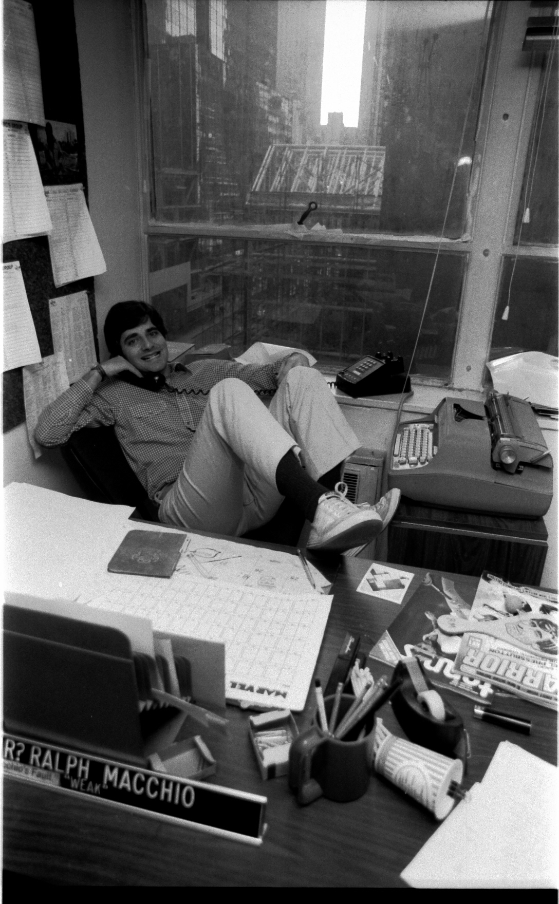 Ralph Macchio in a very typical pose. Ralph has an original Selectric typewriter in front of him, that never left him! Ralph refuses-- to this day-- to step up to any writing device more modern.