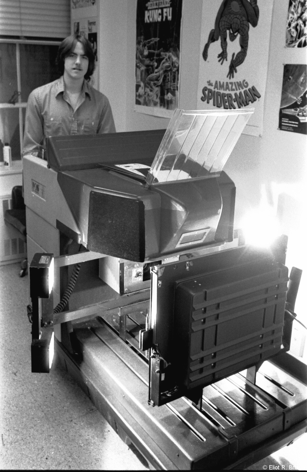 Mark Rogan operating the Pos One System photostat camera. C. 1980.
