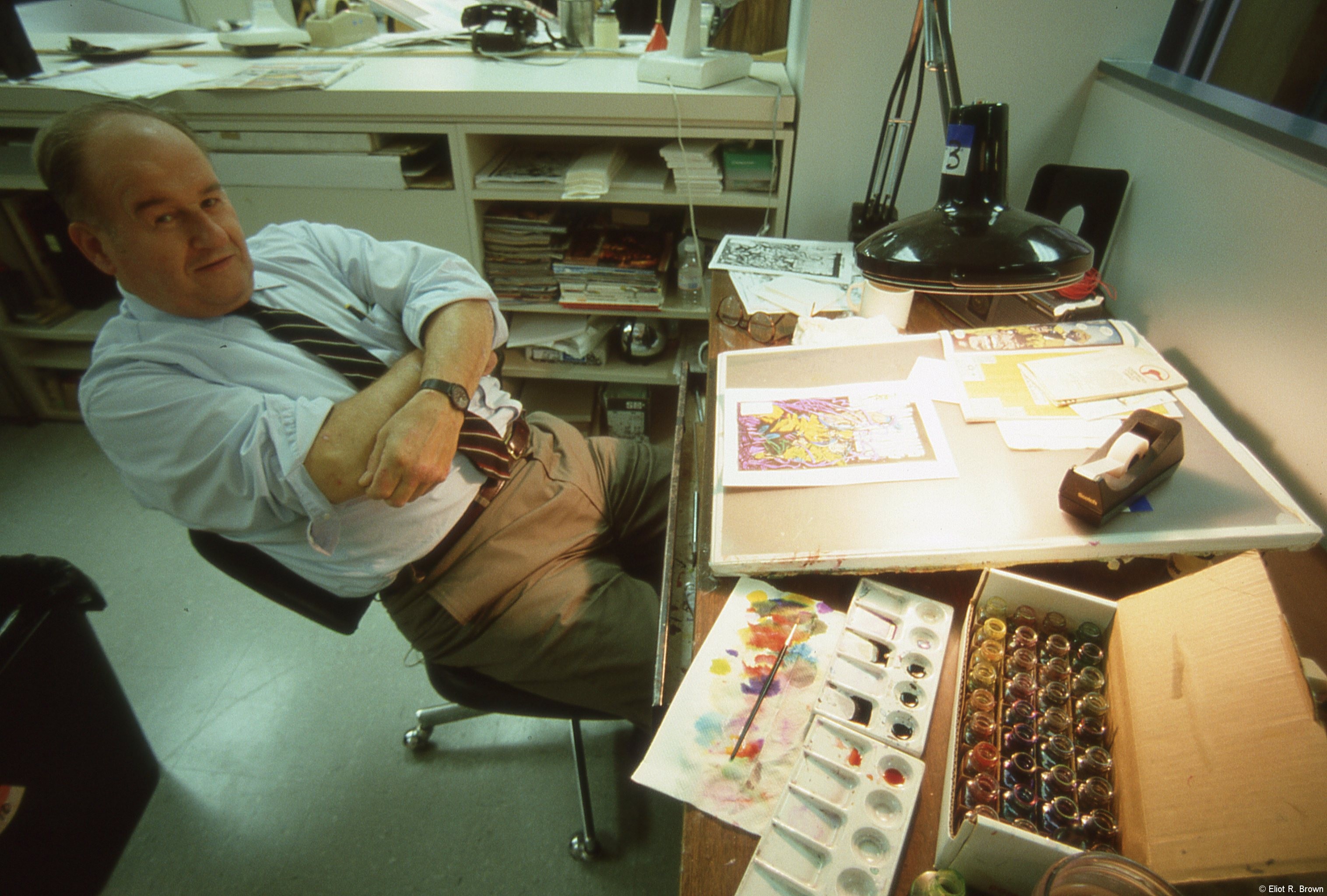 Looking very relaxed, I visit the Marvel Bullpen the day of their moving back up to 10, from where they languished, on 4, while they rebuilt the whole place. I am using a rented super-wide 15mm lens, which makes George look like Egghead. George intensely disliked being out in the middle of the Bullpen floor, in fact at a corner of heavy traffic. But, as he reminded me at the time, he was just keeping his head down. This was late 1992, of note was the Dr. Marten's standard 36 bottle coloring set, filled with Luma Color watercolors. Coloring correction was all done by hand. Corrections were one thing, George was often asked to do entire covers as part of the job. I particularly like seeing George as relaxed as I'd ever seen him. Also of note: his very casual slacks!