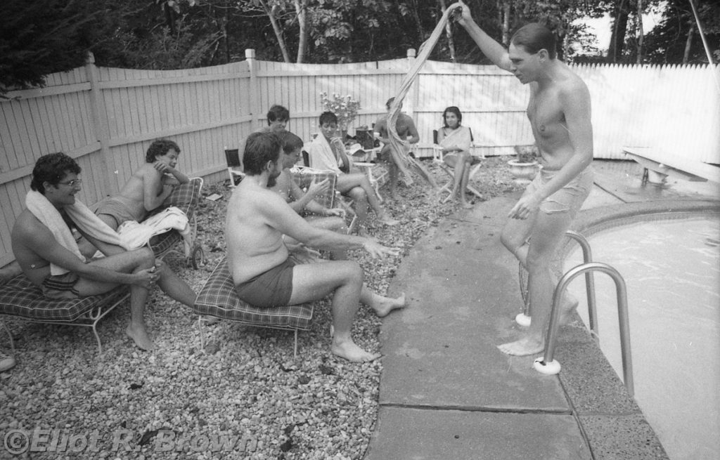Pool-side antics! L-R Ralph, ahem, Editor Raf, Senior Editor Special Projects Bob Budianski, Writer/Creator Peter Gillis (who has of late taken to adding a middle name Peter Benno Gillis; Pete was the other unsung genius (Peter Sanderson being the other) of comics, theorizing and philosophizing epic story lines and character backgrounds… which kind’a sounds like I’m describing the Marvel Universe encyclopedic effort. And I am, both Peters were instrumental in advising and consenting that tome’s content along with Mark Gruenwald. Of personal note, when I as tech illustrator needed either background info, these guys could summon everything needed; further, they could deliver up the most perfect image reference. Often only one image did it.), Editor Bob Harris way in the back of the triple-head line-up, Jack getting a towel full from Mike, Lisa Hach then Mark Gru with the towel in front of him and finally Editrix Extraordinaire Annie Nocenti. That’s the sitting run down—standing is lean-as-a-bean Mike Carlin!