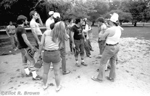 Mid-game strategy session. Team Captain and fellow stat-camera operator, the late Robbie Carosella is image center in a custom made black T-shirt. He is yelling at us all to reach down deep and find the win. Or something like that… Left to Right: Walking up, Creator John Romita Jr., Nel Yomtov, Jim Novak, Secretary Helen Katz in the forground, far to the rear is Editor in Chief, Jim Shooter, between Helen and Jim is Danny Fingeroth. Again, to the rear, is Intern Harry Eisenstein, Robbie, directly behind Robbie is Editorial Assistant Irene Vartanoff, to the rear is Creator and Agent, the late Mike Friedrich. In the left of the pile to the right, is Creator Artist Bob Budiansky, deep to the rear is Archie Goodwin, way in front Production Worker Ken Feduniewicz, sandwiched between is an un-remembered Mail Room Worker (sorry! Reggie?) and the arm of Production Worker Joe Albelo.